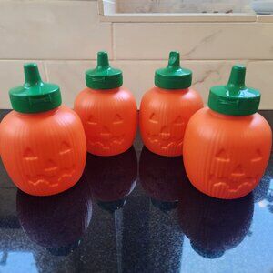 4 plastic pumpkin squeeze bottles/condiment bottles